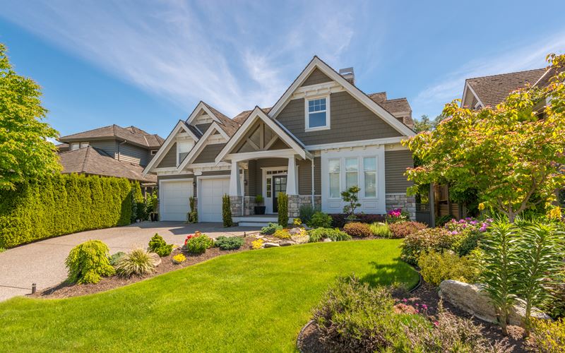 Fancy house with a bright green yard